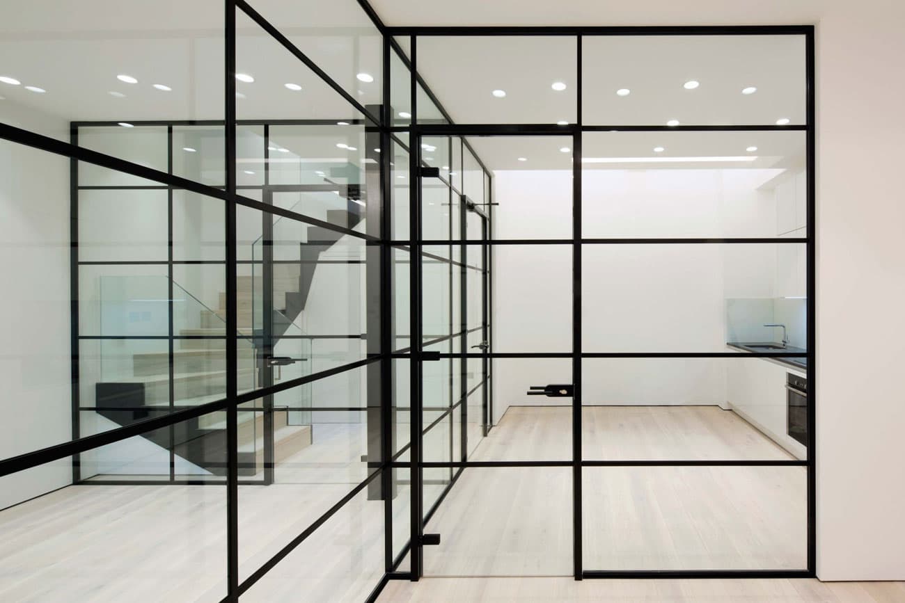 Floor-to-ceiling Crittall-style glass partition